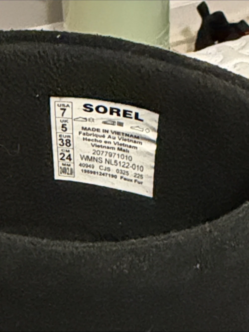 The image shows a pair of black SOREL Women's Explorer III Slip-On waterproof